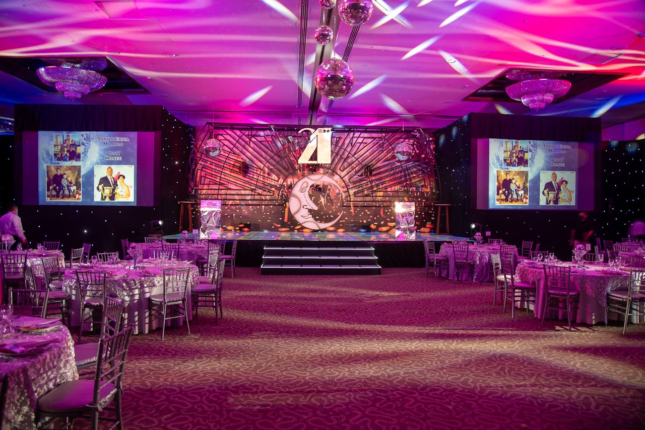 services-05 Vibrant event hall set up for a themed dinner with elegant decorations and lighting.